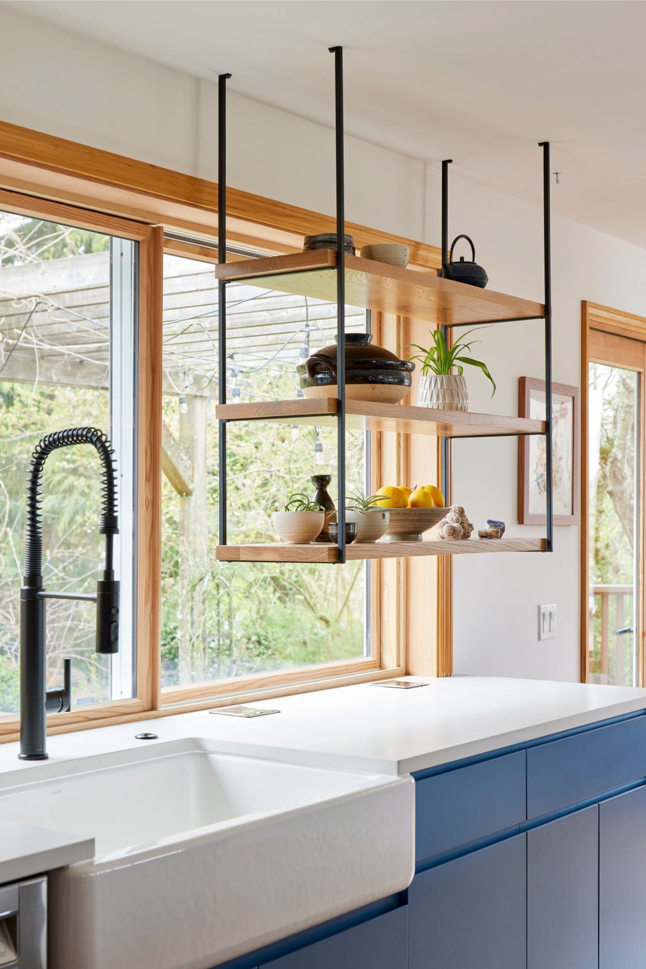 kitchen remodel in seattle with blue cabinets and open shelving