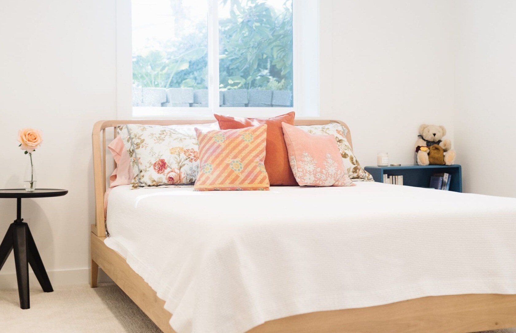 bedroom basement remodel with white walls, light carpet, and queen bed bedroom basement remodel with white walls, light carpet, and queen bed